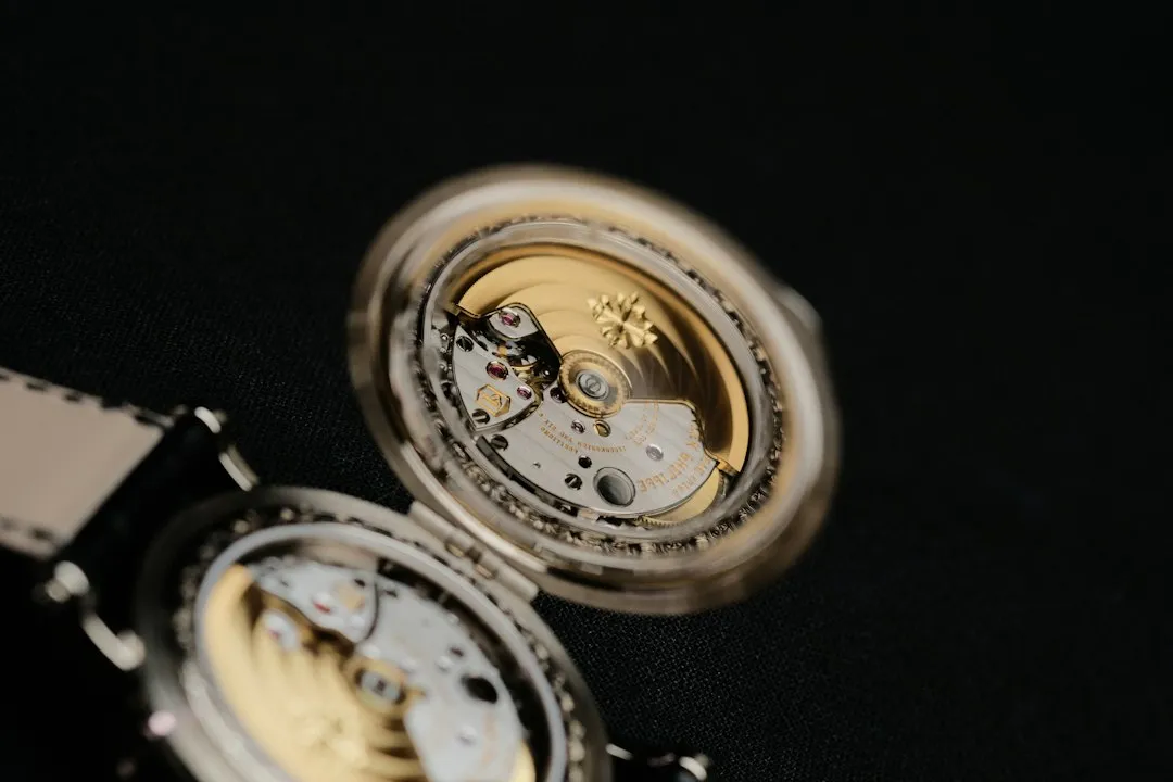 A close-up view of a mechanical watch movement inside an open case back.
